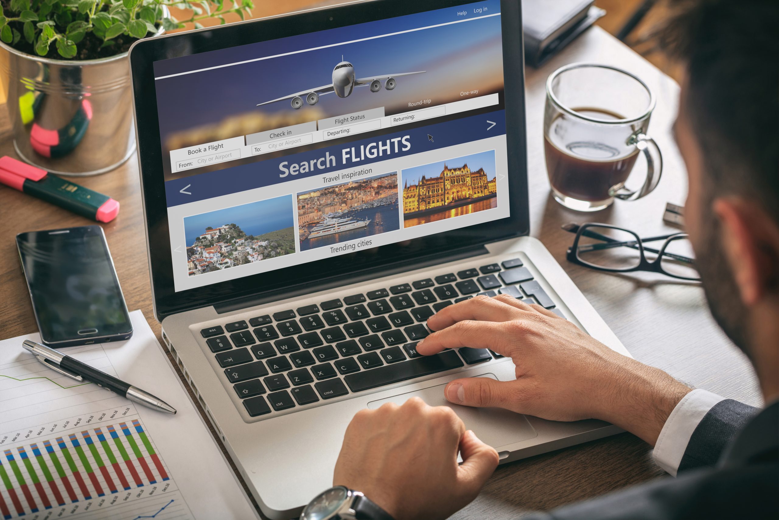 A customer is searching for flight tickets on a laptop