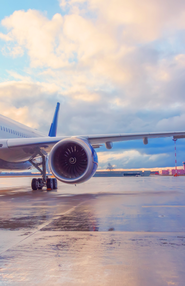 A commercial airplane is parked at an airport