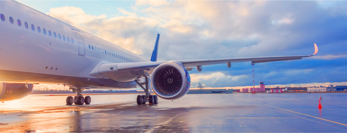 A commercial airplane is parked at an airport